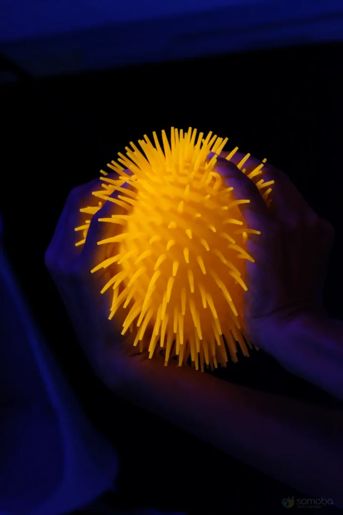 balle à picots fosfluorescente, toucher 
